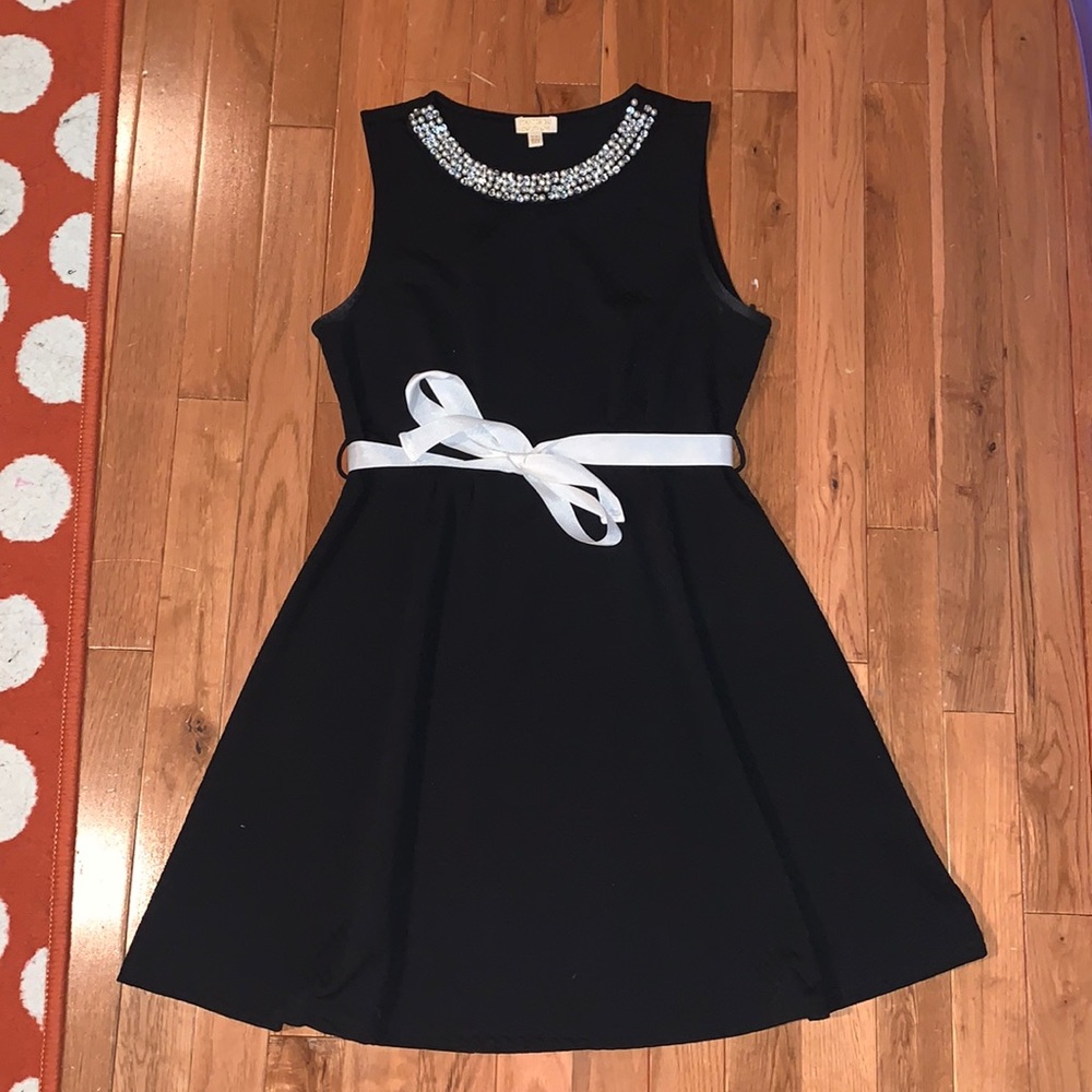 Girls Monteau Couture black dress with pearl neck line and ribbon belt